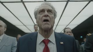 John Goodman staring upward in Digger