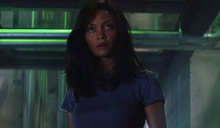 Thandiwe Newton looks forward mysteriously in a lab in Mission: Impossible 2.