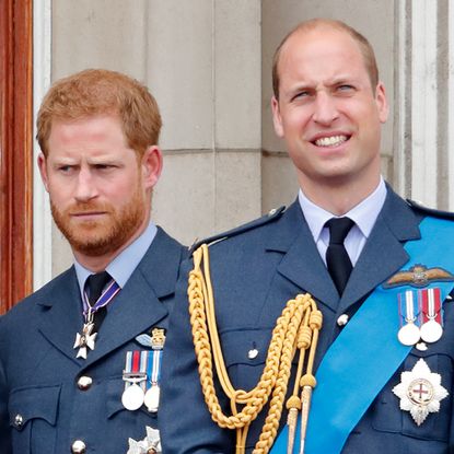 Meghan Markle, Prince Harry, Prince William, and Kate Middleton watch a flypast to mark the centenary of the Royal Air Force from the balcony of Buckingham Palace on July 10, 2018.