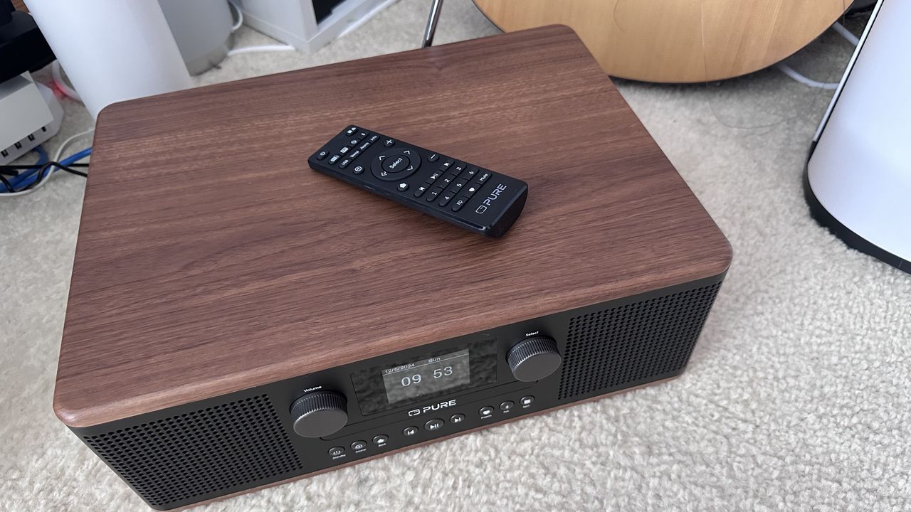 Pure Classic C-D6 DAB/FM Radio, CD player, Bluetooth speaker with a remote control on a carpet