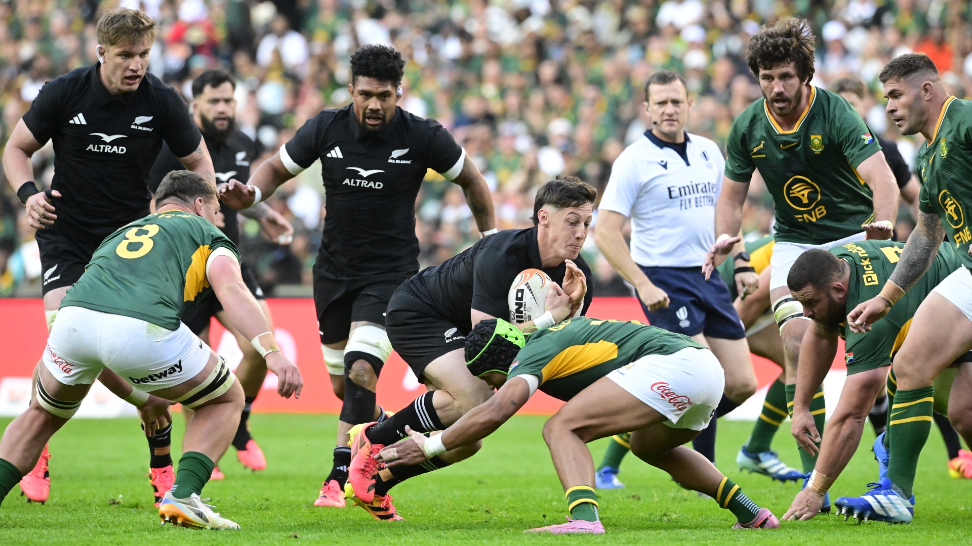 Cam Roigard being tackled during a Rugby's Greatest Rivalry 2026 match between South Africa and New Zealand