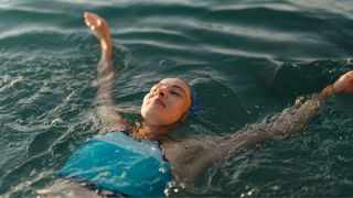 Woman swimming in open water