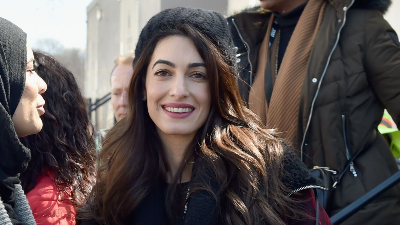 Amal Clooney wearing knitted beanie in 2018