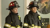 Maya and Andy side by side in their firefighter gear in Station 19 season 6