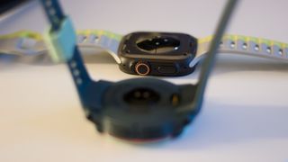 Garmin Instinct 3 next to the Apple Watch Ultra 2