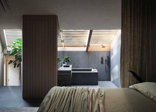 a bedroom with an open plan ensuite