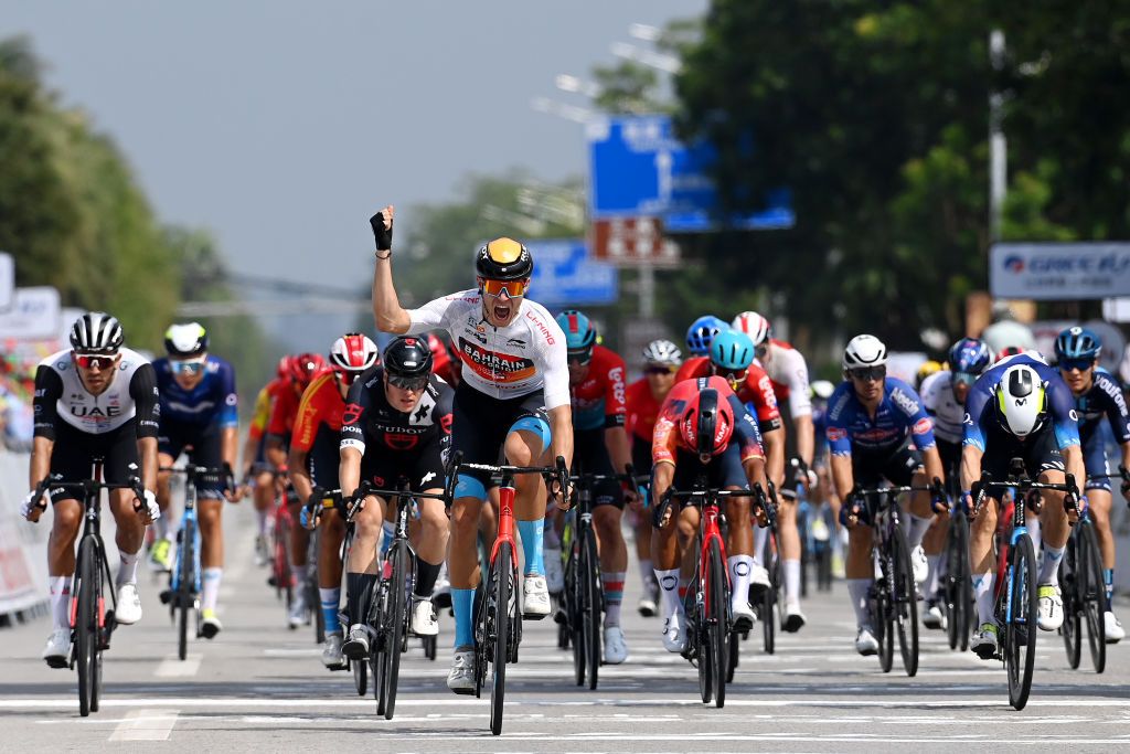 QINZHOU CHINA OCTOBER 13 Jonathan Milan of Italy and Team Bahrain Victorious White best young jersey celebrates at finish line as stage winner during the 4th GreeTour of Guangxi 2023 Stage 2 a 1496km stage from Beihai to Qinzhou UCIWT on October 13 2023 in Qinzhou China Photo by Tim de WaeleGetty Images