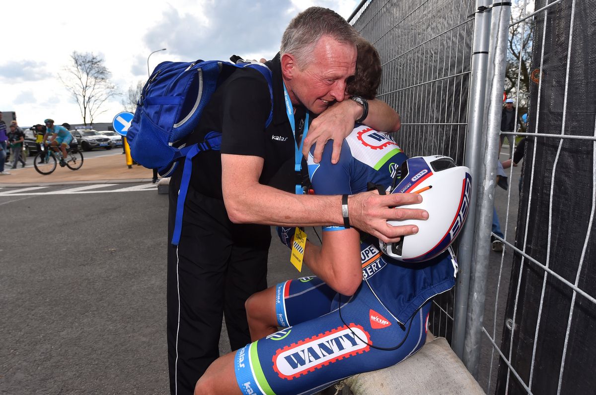 Dimitri Claeys (Wanty-Groupe Gobert) gets a hug from his soigneur
