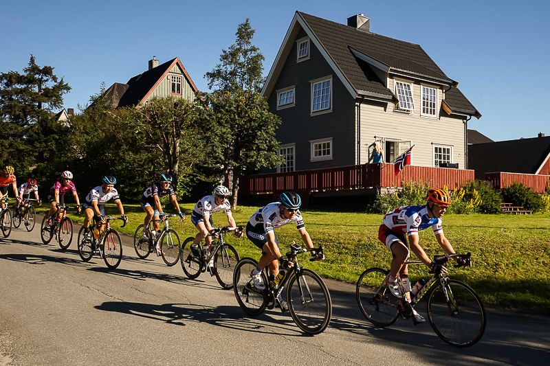 A local watches the race come by their house