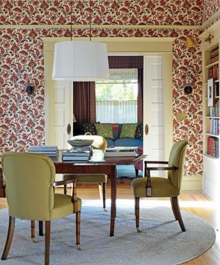 Dining room with wallpaper and pretty chairs