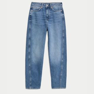 A cutout of blue denim barrel leg jeans from m&S against a light background