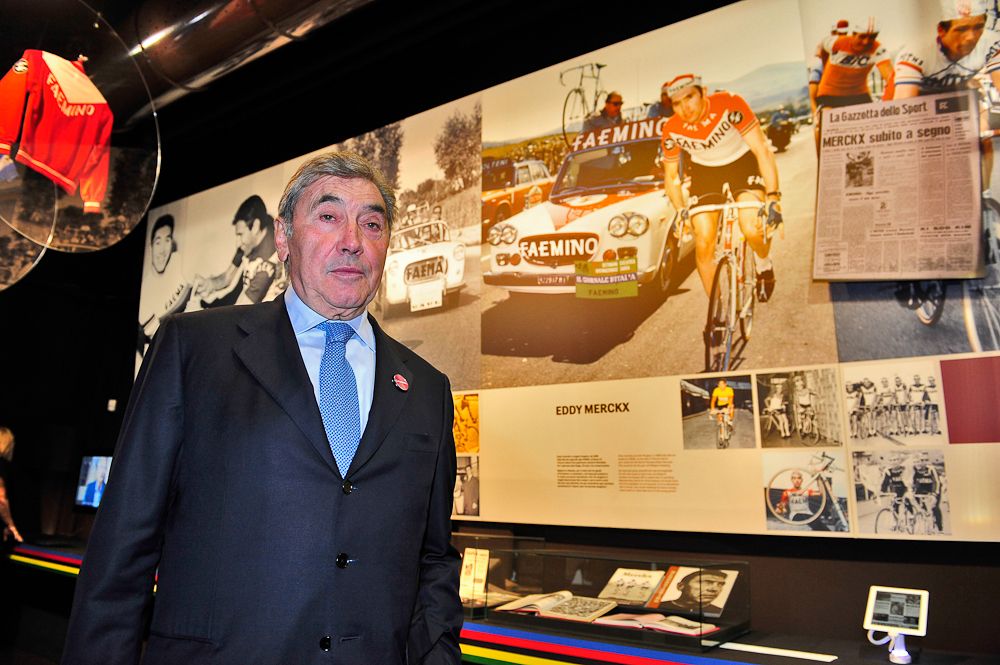 Eddy Merckx stands with the exhibition about Faema cycling teams that recently opened at the Faema coffee machine museum.