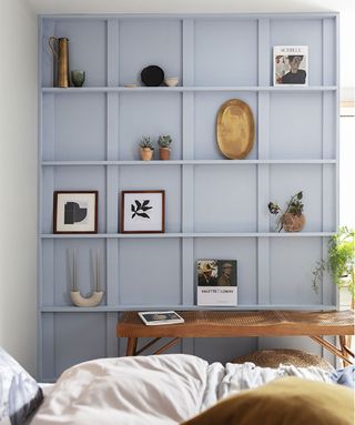 bedroom wall storage with picture ledges painted blue