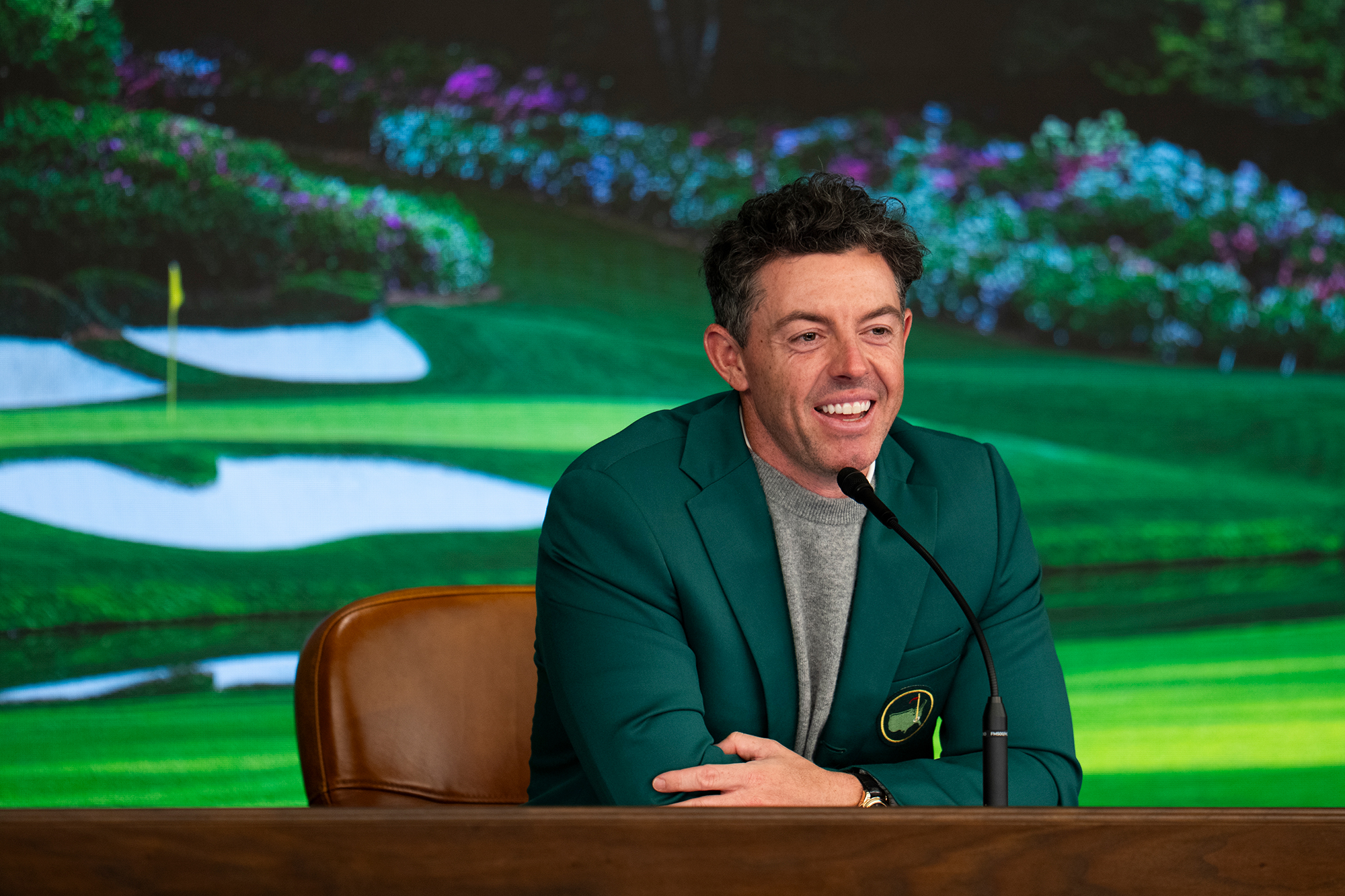 Rory McIlroy wearing his Green Jacket while in his press conference at the Masters as defending champion