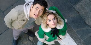 Last Christmas Henry Golding and Emilia Clarke looking up at the sky