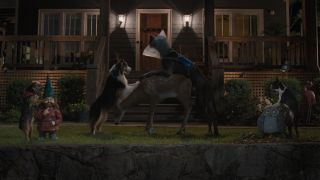 The dogs of Strays humping various lawn ornaments, during a night scene.