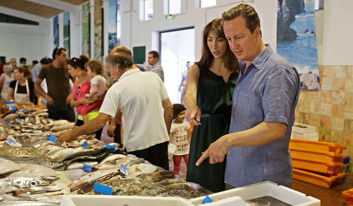 ALJEZUR. PORTUGAL - JULY 26: British Prime Minister David Cameron and his wife Samantha Cameron look at fish in the market of Aljezur on July 26 in Aljezur, Portugal. The Prime Minister is sp
