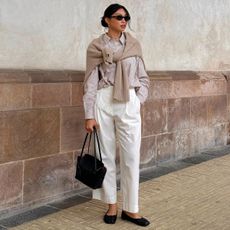 Spring Trouser Outfits: @michellelin.lin wears white trousers with a beige striped shirt