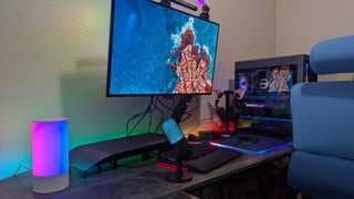 A full desk setup with many Razer products, all lit up with RGB lighting.