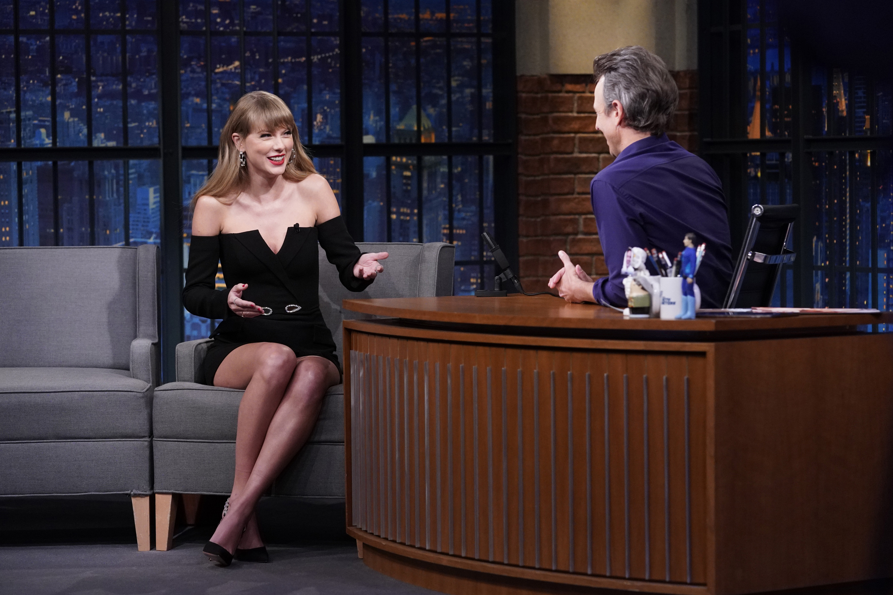 Taylor Swift arrives at Late Night With Seth Meyers for her interview wearing a black dress