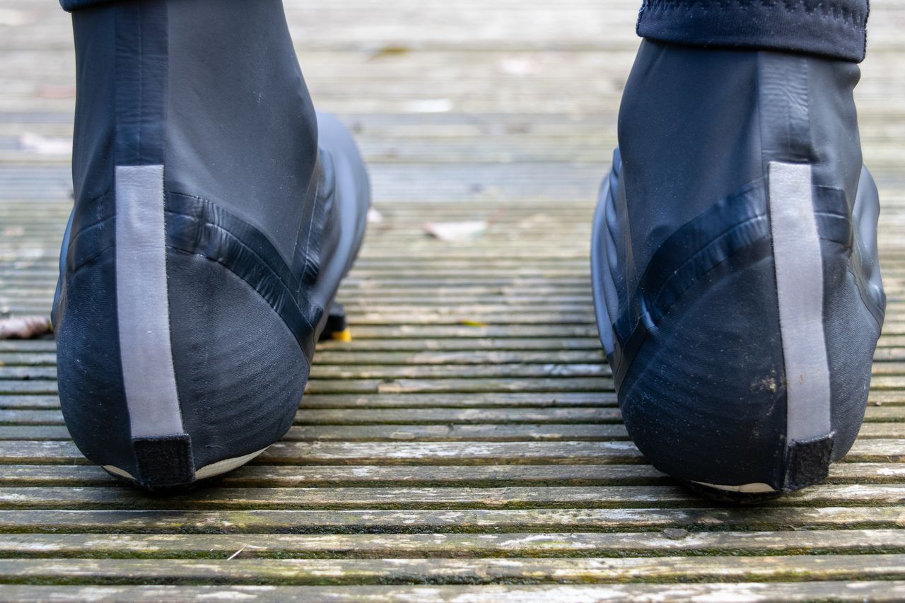 A rider wearing the GripGrab Aquashield overshoes