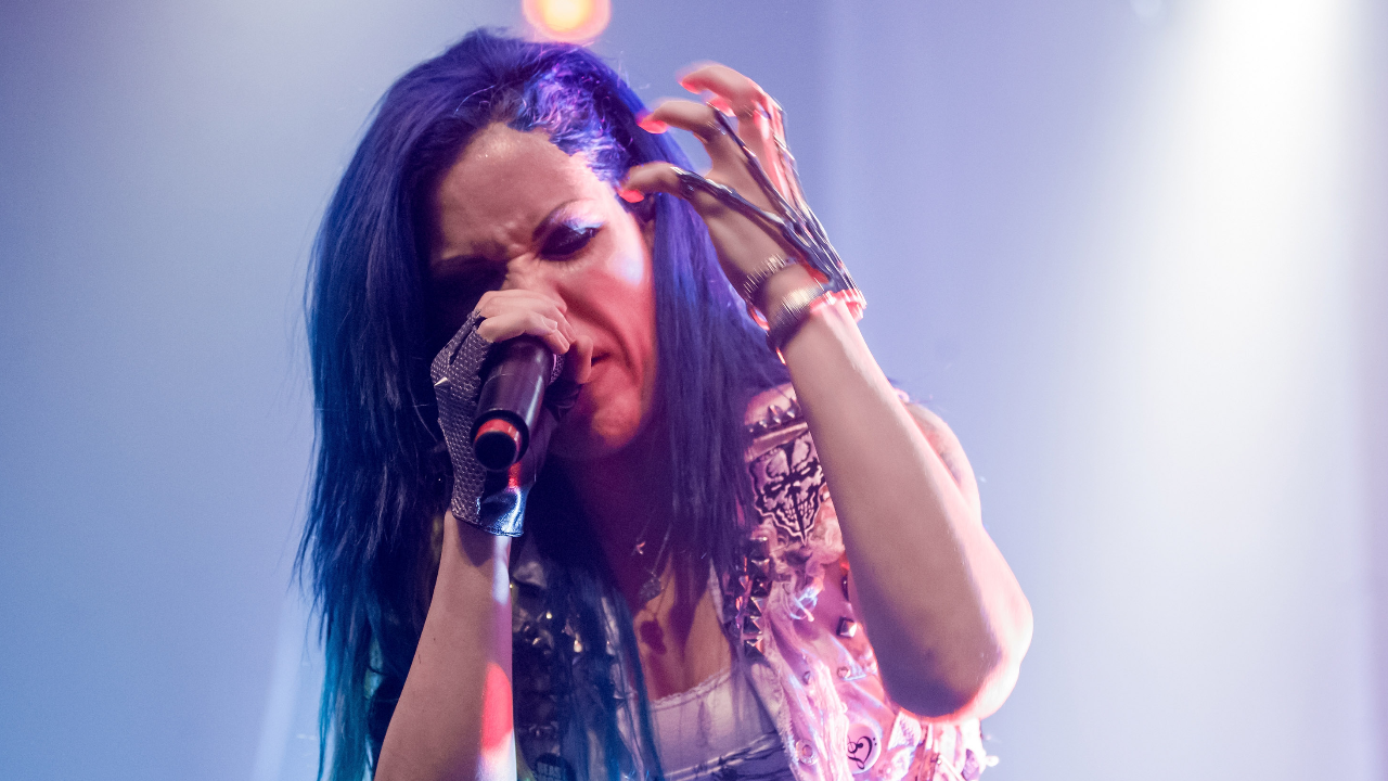 Alissa White-Gluz onstage with Arch Enemy in 2014