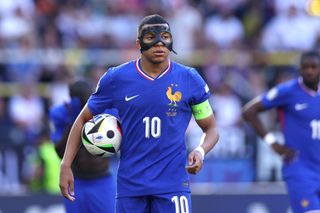 France Euro 2024 squad Kylian Mbappe of France looks on as he prepares to take a penalty-kick whilst wearing his black protective mask during the UEFA EURO 2024 group stage match between France and Poland at Football Stadium Dortmund on June 25, 2024 in Dortmund, Germany. (Photo by Dean Mouhtaropoulos/Getty Images)