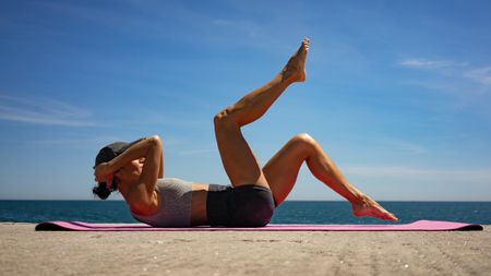 a woman doing Pilates toe taps