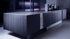 Black grooved kitchen island, one of the Kitchen trends 2025