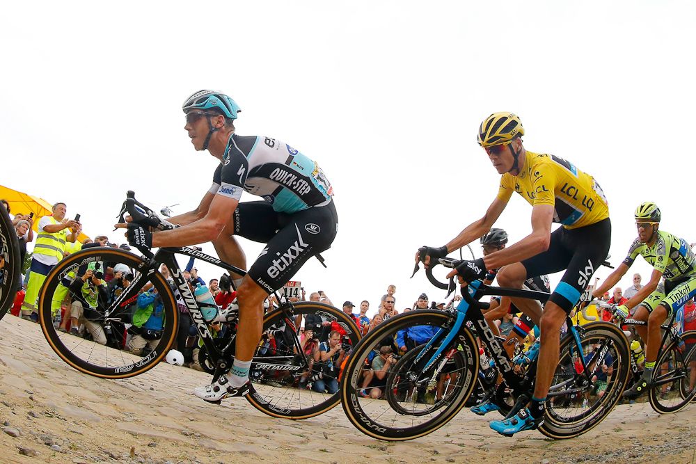 Chris Froome follows Tony Martin during stage 4.