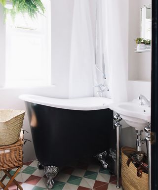 small bathtub with shower curtain