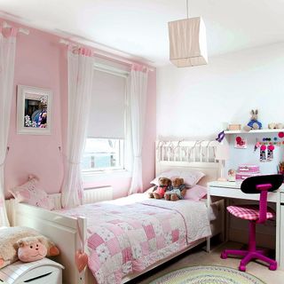 kids bedroom with photoframe on pink wall