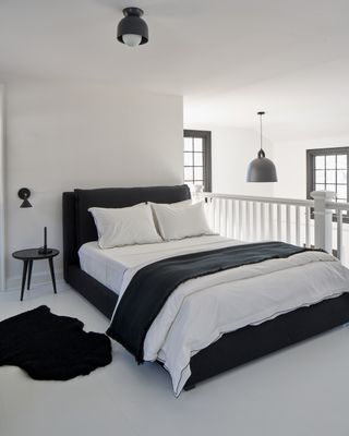 a mezzanine bedroom in a modern cottage