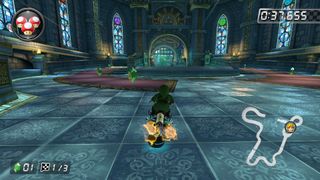 Mario Kart 8 Deluxe Switch screenshot showing Link racing through Hyrule Castle on a motorcycle