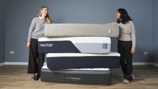 Tom's Guide's sleep editor and mattress tester stand either side of a tall pile of mattresses that we have tested and recommend as the best choices for all sleepers, including the Nectar Classic mattress, the Helix Midnight Luxe and the Siena Mattress