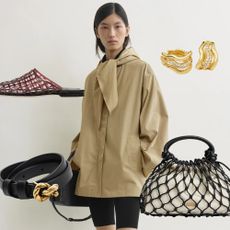 A model wearing a trench coat from Toteme.