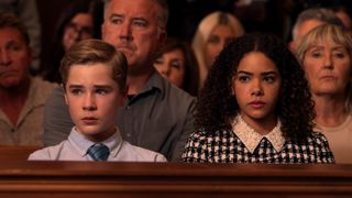 Diesel La Torraca as Austin Miller and Antonia Gentry as Ginny Miller in a courtroom in Ginny & Georgia season 3