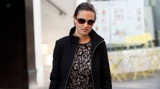 Pippa Middleton is seen in October 2011 wearing a lace mini dress and slouchy chestnut brown boots