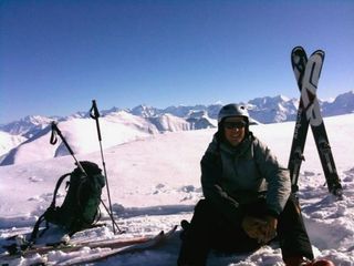 Christoph Sauser enjoys a break while backcountry skiing.