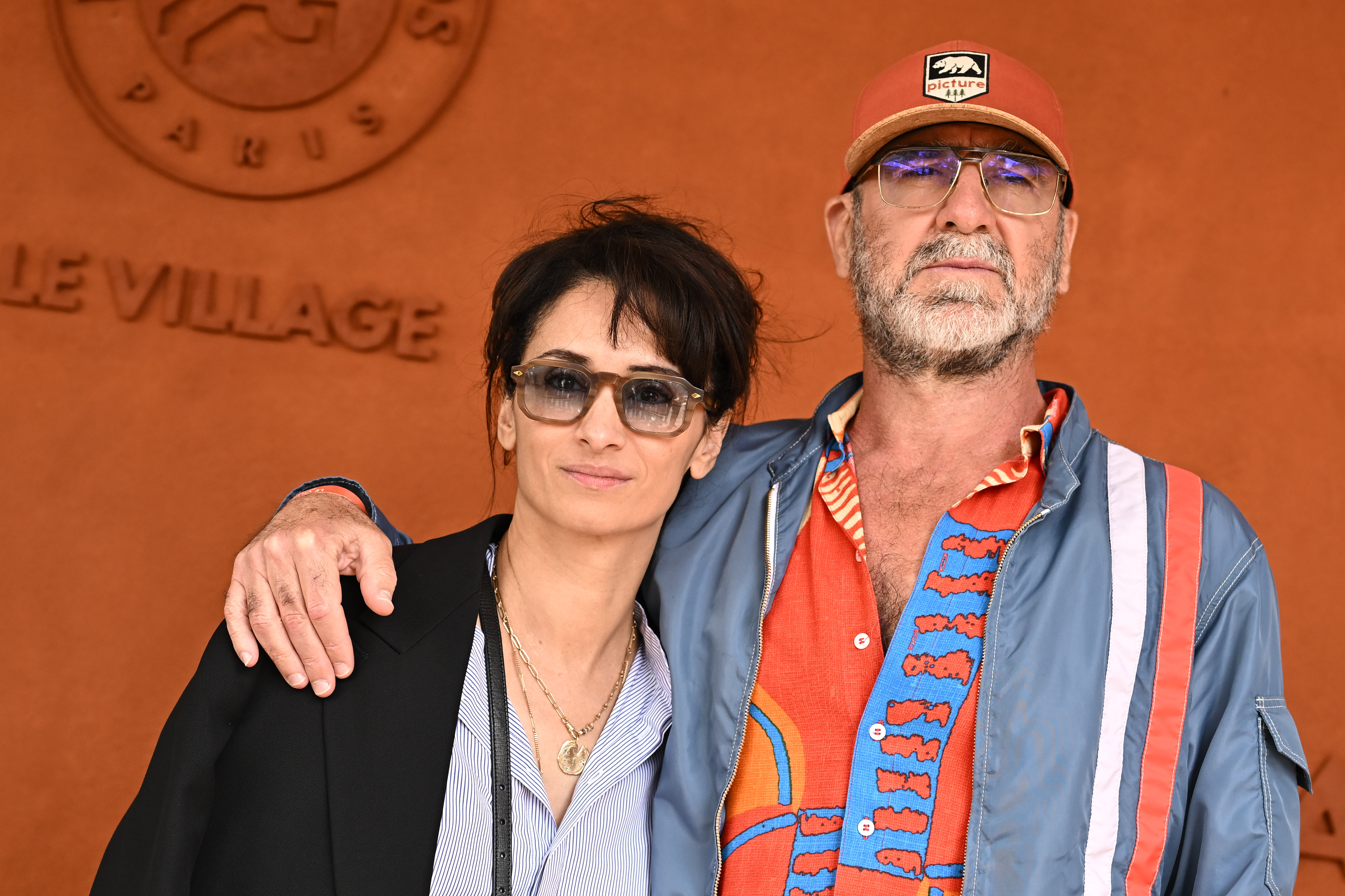 Eric Cantona and wife Rachida Brakni attend the French Open tennis tournament at Roland Garros in June 2024.