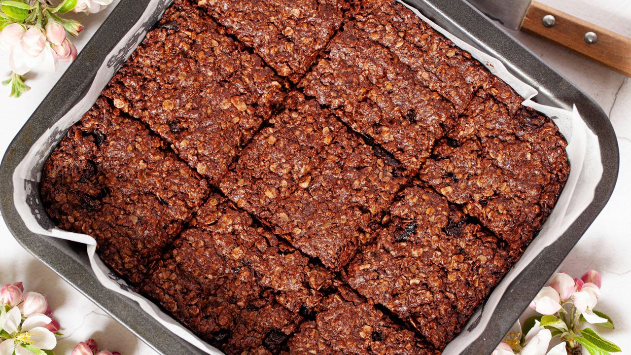 Chocolate flapjacks in tin lined with baking paper