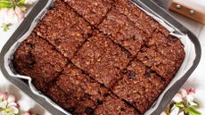 Chocolate flapjacks in tin lined with baking paper