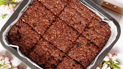 Chocolate flapjacks in tin lined with baking paper