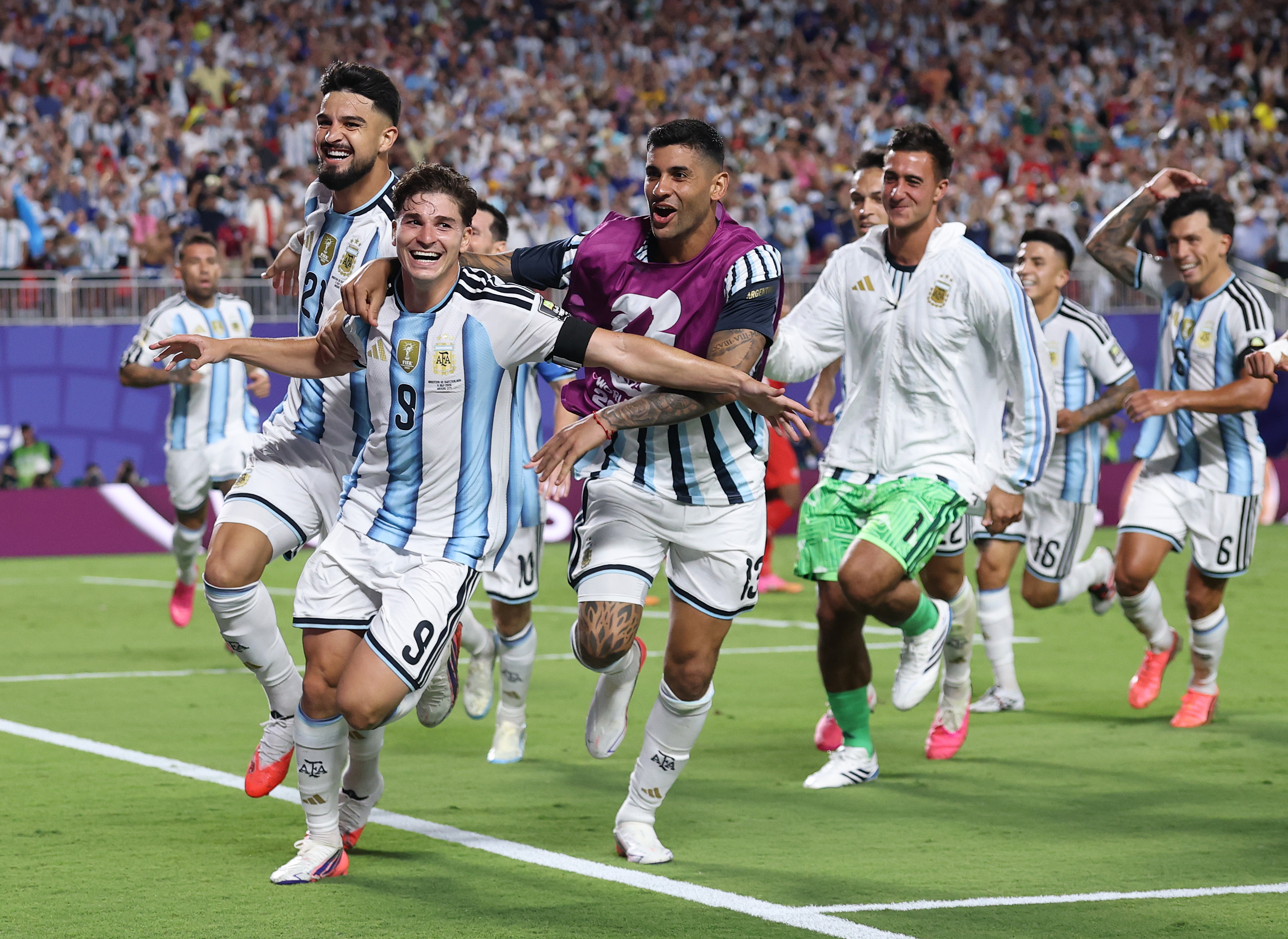 KANSAS CITY, MISSOURI - JULY 11: Julian Alvarez #9 of Argentina celebrates with teammates after scoring his team&amp;amp;apos;s second goal during the FIFA World Cup 2026 Quarter Final match between Argentina and Switzerland at Kansas City Stadium on July 11, 2026 in Kansas City, Missouri. (Photo by Carl Recine/Getty Images)