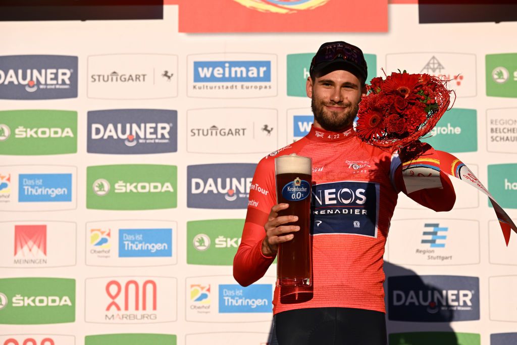WEIMAR GERMANY AUGUST 24 Filippo Ganna of Italy and Team INEOS Grenadiers celebrates at podium as Red Leader Jersey winner during the 37th Deutschland Tour 2022 Prologue a 26km individual time trial from Weimar to Weimar DeineTour on August 24 2022 in Weimar Germany Photo by Stuart FranklinGetty Images