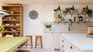white kitchen with oak freestanding dresser and kitchen island