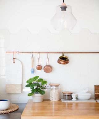 Hexagon tile backsplash, brass rail