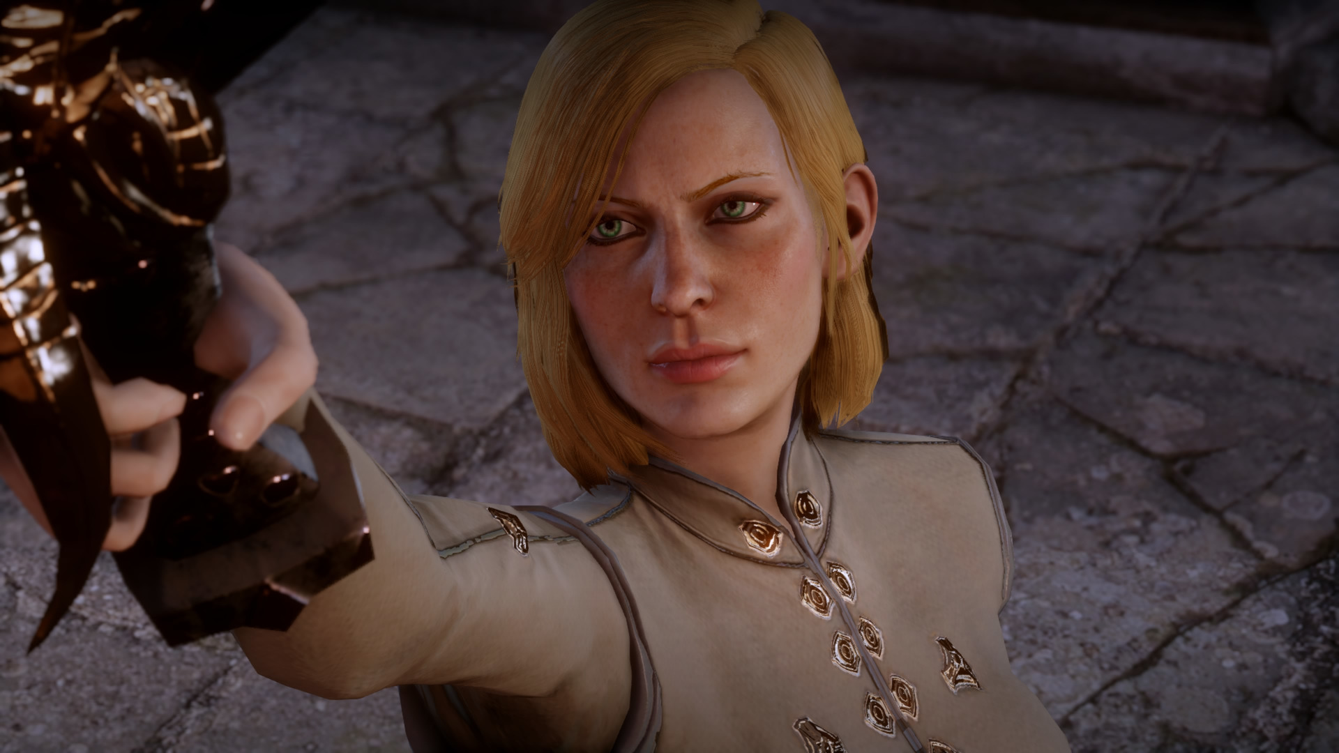 Inquisitor Trevelyan raises a sword in Skyhold in one of the best third-person RPGs, Dragon Age Inquisition