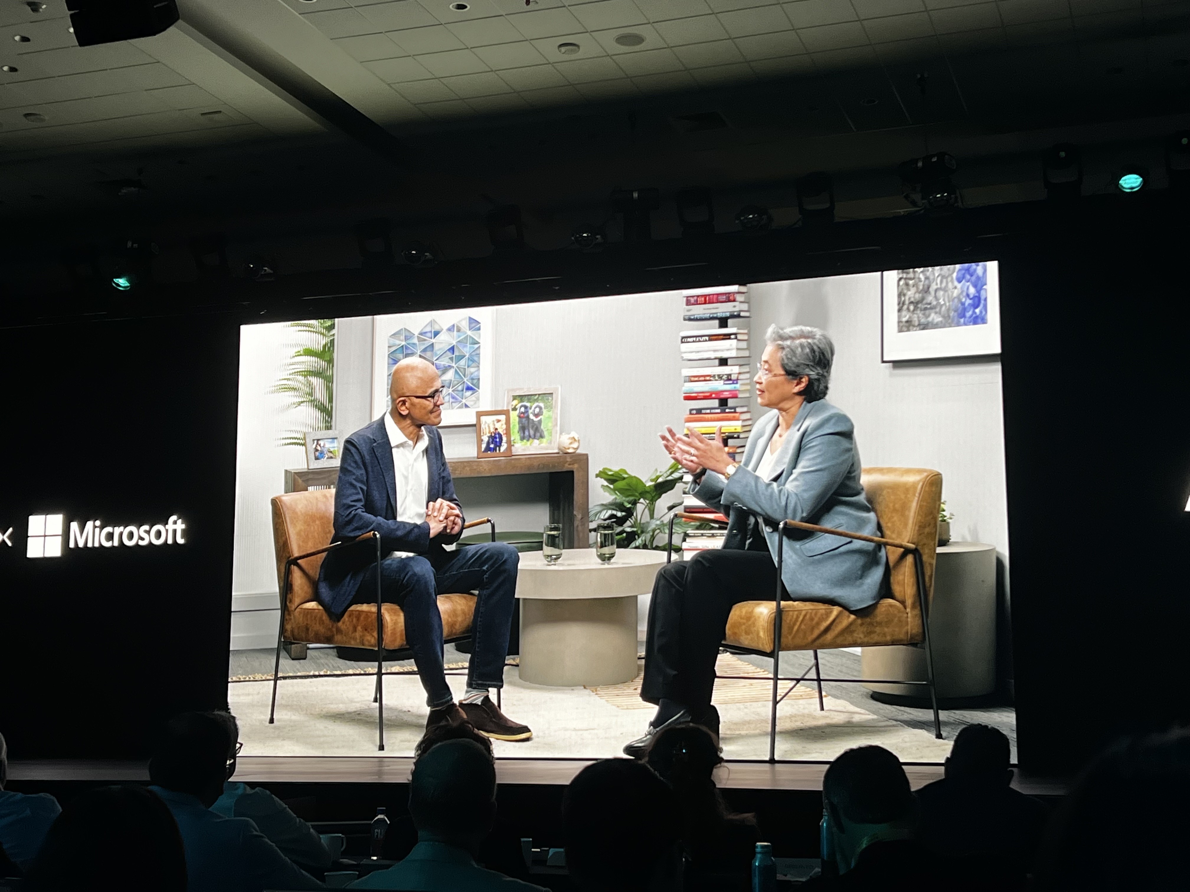 Satya Nadella, CEO of Microsoft, and Lisa Su speak on stage.