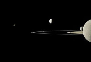 Cassini snapped this partial portrait of Saturn's rings and moons in July 2011. From left to right, five moons are visible in this picture: Janus, Pandora (at the edge of the thin ring near the image's center), Enceladus, Mimas and Rhea.